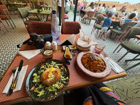 A table of Moroccan salads and mains on the terrace