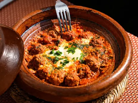 Kefta tagine with egg in an earthenware dish