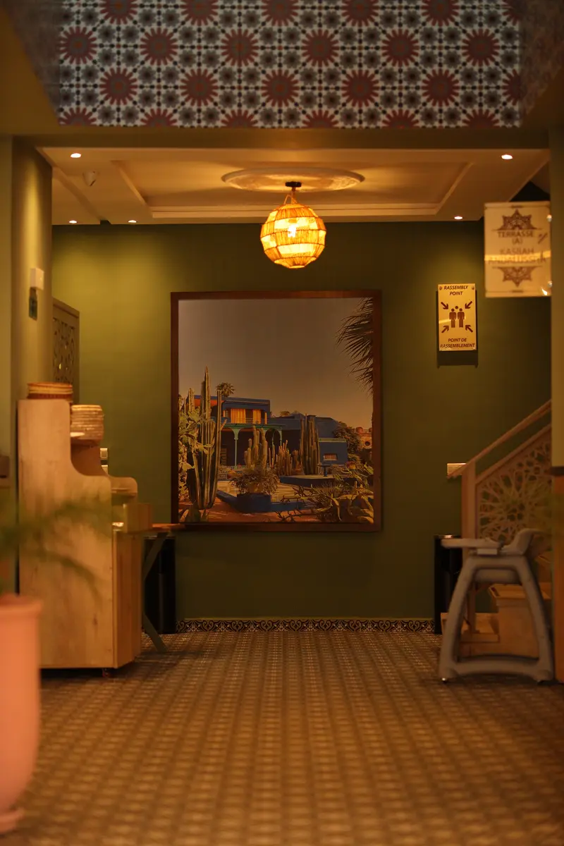 Entrance hall with zellige frieze and painted mural