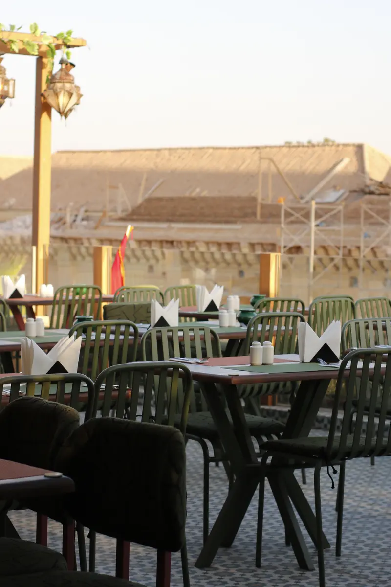 Rooftop tables looking out over the Kasbah at golden hour