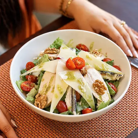 Chicken salad with walnuts and cherry tomatoes